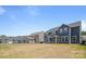 Spacious backyard view showcasing a home with a covered porch perfect for outdoor relaxation and entertaining at 235 Boxelder Rd, Clover, SC 29710