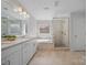 Bright bathroom with white double sink vanity, soaking tub, and glass enclosed shower at 235 Boxelder Rd, Clover, SC 29710