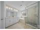 Elegant bathroom featuring a double vanity, soaking tub, and glass-enclosed shower at 235 Boxelder Rd, Clover, SC 29710