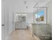 Bright bathroom featuring a double vanity, soaking tub, and glass-enclosed shower at 235 Boxelder Rd, Clover, SC 29710