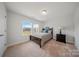 Comfortable bedroom features a queen bed, side table with lamp, and a window at 235 Boxelder Rd, Clover, SC 29710
