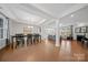 Open-concept dining room with coffered ceilings, hardwood floors, and views of the backyard and living room at 235 Boxelder Rd, Clover, SC 29710