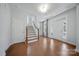Bright foyer with hardwood floors, staircase, and a front door featuring sidelights and a transom window at 235 Boxelder Rd, Clover, SC 29710