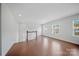 Open hallway with hardwood floors, natural lighting, and staircase leading to additional living spaces at 235 Boxelder Rd, Clover, SC 29710