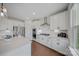 Bright kitchen with white cabinets, stainless steel appliances, sleek countertops, and modern fixtures at 235 Boxelder Rd, Clover, SC 29710