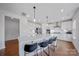 Modern kitchen features a large island with seating, stainless steel appliances, and stylish pendant lighting at 235 Boxelder Rd, Clover, SC 29710