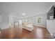 Bright, airy living room showcasing a comfortable sectional sofa and natural light from the large windows at 235 Boxelder Rd, Clover, SC 29710