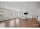 Spacious living room with hardwood floors, ample natural light, and a comfortable couch for relaxing at 235 Boxelder Rd, Clover, SC 29710