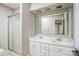 Bright bathroom featuring double sinks, white cabinetry and a glass enclosed shower at 2371 Lazy Oak Dr, Lancaster, SC 29720