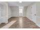 Upstairs bedroom featuring an alcove, neutral paint, hardwood floors, and a bright window at 2371 Lazy Oak Dr, Lancaster, SC 29720