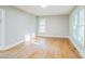 Open and bright bedroom with gleaming hardwood floors and neutral paint at 2371 Lazy Oak Dr, Lancaster, SC 29720
