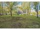 Beautiful home with a large front yard surrounded by mature trees and a welcoming porch at 2371 Lazy Oak Dr, Lancaster, SC 29720