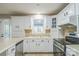 Eat-in kitchen features bright cabinetry, stainless appliances and double sink at 2371 Lazy Oak Dr, Lancaster, SC 29720