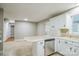 Spacious eat-in kitchen features an eat-at bar, tile flooring and stainless dishwasher at 2371 Lazy Oak Dr, Lancaster, SC 29720