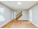 Well-lit living area showcases hardwood floors, modern lighting, and access to other rooms in the home at 2371 Lazy Oak Dr, Lancaster, SC 29720