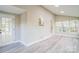 Bright sunroom with many windows, modern floors, vaulted ceilings, and access to the outdoor space at 2371 Lazy Oak Dr, Lancaster, SC 29720