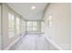 Sunroom featuring updated flooring, a vaulted ceiling, multiple windows, and great natural light at 2371 Lazy Oak Dr, Lancaster, SC 29720