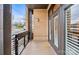 A view of private outdoor balcony featuring brick siding, black railings, and views of the street at 2401 Euclid Ave, Charlotte, NC 28203