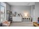 Bright bedroom with a large dresser, stylish decor, comfortable seating, and a window providing natural light at 2401 Euclid Ave, Charlotte, NC 28203