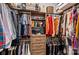 Walk-in closet with custom shelves, drawers, and hanging rods for optimal storage at 2401 Euclid Ave, Charlotte, NC 28203
