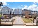 A community gathering area features modern architectural townhomes with outdoor grill and dining spaces at 2401 Euclid Ave, Charlotte, NC 28203