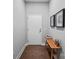A view of a modern entryway with grey walls and wood floors at 2401 Euclid Ave, Charlotte, NC 28203