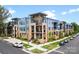 A modern apartment complex with blue and beige exterior and well-maintained landscaping at 2401 Euclid Ave, Charlotte, NC 28203