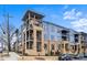 A modern apartment complex with blue and beige exterior and well-maintained landscaping at 2401 Euclid Ave, Charlotte, NC 28203