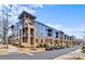 A modern apartment complex with blue and beige exterior and well-maintained landscaping at 2401 Euclid Ave, Charlotte, NC 28203