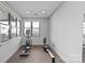 Fitness room with elliptical and rowing machines, and large windows with natural light at 2401 Euclid Ave, Charlotte, NC 28203