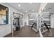 Weight training station featuring multiple machines, free weights, and mirrored walls at 2401 Euclid Ave, Charlotte, NC 28203