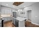 Modern kitchen features grey cabinets, quartz countertops, an island, and stainless steel appliances at 2401 Euclid Ave, Charlotte, NC 28203