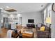 Open-concept living area showcases a modern kitchen, hardwood floors and comfortable seating with stylish decor at 2401 Euclid Ave, Charlotte, NC 28203