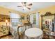 Sunny bedroom featuring brass bed frame and yellow walls providing cozy ambiance at 292 Mocksville Hwy, Statesville, NC 28625