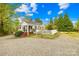 Charming home with white picket fence and a welcoming brick walkway at 292 Mocksville Hwy, Statesville, NC 28625