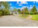 Charming home framed by lush greenery and a welcoming gravel driveway at 292 Mocksville Hwy, Statesville, NC 28625