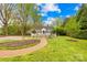 Charming home with a bright red front door, white picket fence, and a beautifully landscaped yard at 292 Mocksville Hwy, Statesville, NC 28625