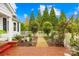 A garden path and white picket fence lead to this home, with lots of lush greenery at 292 Mocksville Hwy, Statesville, NC 28625