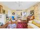 Cozy living room featuring hardwood floors, colorful decor, and a charming vintage aesthetic at 292 Mocksville Hwy, Statesville, NC 28625
