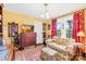 Inviting living room with floral sofa, wood floors, and lots of natural light at 292 Mocksville Hwy, Statesville, NC 28625