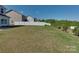 Expansive backyard featuring well-maintained lawn and privacy fence at 317 Contentment Dr, Locust, NC 28097