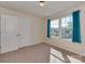 Bedroom with neutral carpet, natural light, and a double door closet at 317 Contentment Dr, Locust, NC 28097