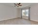 Bright, minimalist bedroom features modern vinyl plank floors, large windows, and neutral paint at 317 Contentment Dr, Locust, NC 28097