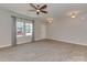 Living room features a window for natural light, luxury vinyl plank flooring and neutral wall color at 317 Contentment Dr, Locust, NC 28097