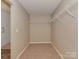 Empty walk-in closet with neutral walls, carpet floors and wire shelving at 317 Contentment Dr, Locust, NC 28097