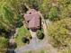 An aerial view of a house featuring lush greenery, landscaping, a driveway, and a deck at 3605 Ridgetop Rd, Sherrills Ford, NC 28673