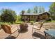 Backyard patio with a fire pit and seating area, perfect for outdoor entertaining at 3605 Ridgetop Rd, Sherrills Ford, NC 28673