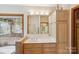 Well-lit bathroom with a double sink vanity and built-in storage at 3605 Ridgetop Rd, Sherrills Ford, NC 28673