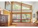 Comfortable bedroom featuring large windows with tree views, natural light, and ample closet space at 3605 Ridgetop Rd, Sherrills Ford, NC 28673
