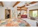 Primary bedroom boasts wooden beams, and a seamless transition into the living room at 3605 Ridgetop Rd, Sherrills Ford, NC 28673